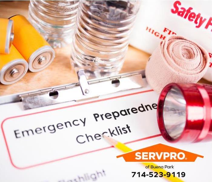 Emergency supplies sit amongst an emergency checklist.